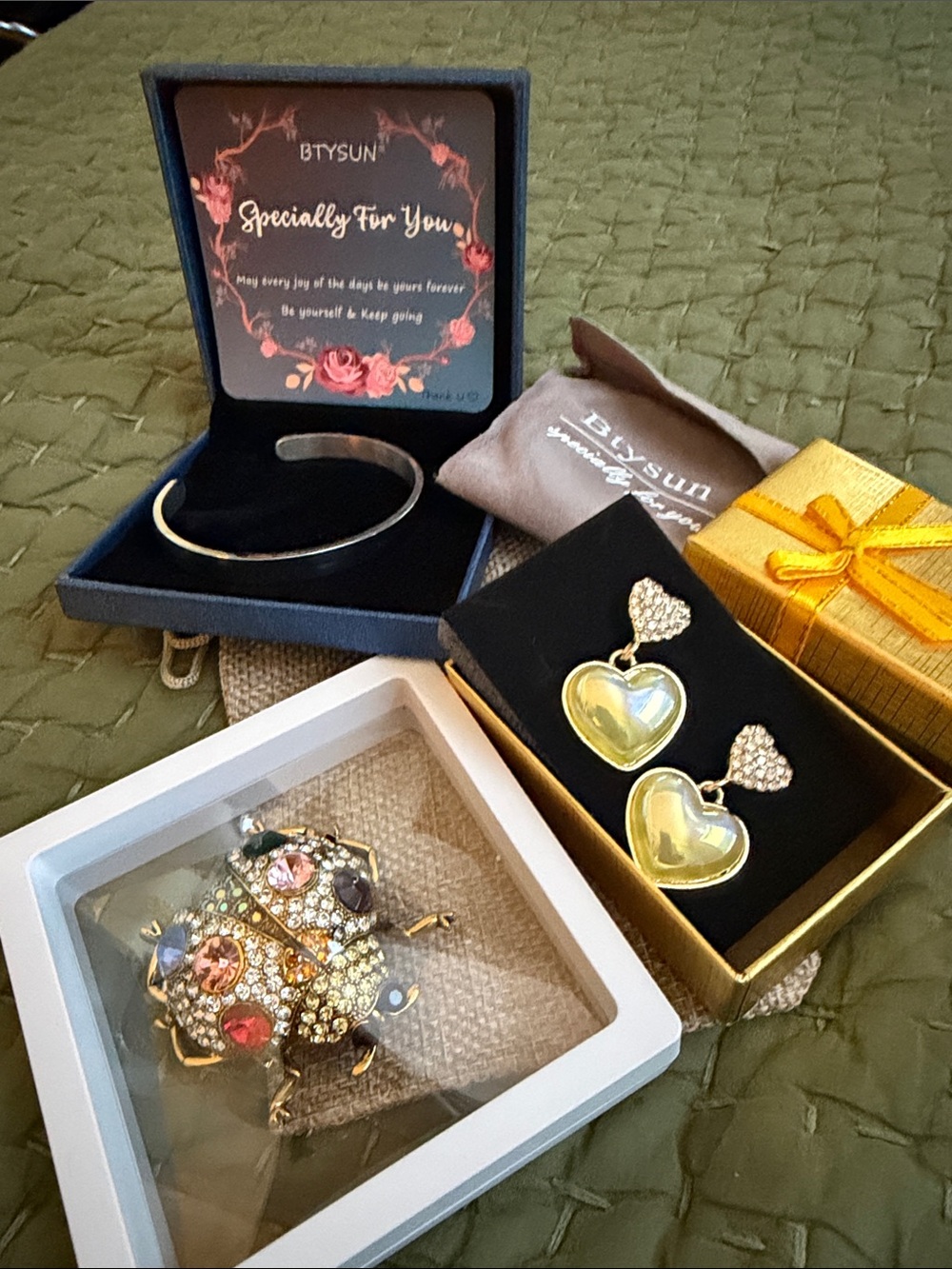 3piece set Gold toned earrings, ladybug brooch, and silver tone bracelet NIB